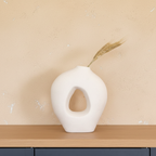 Lumira White Ceramic Sculptural Vase on oak shelf with limewash wall